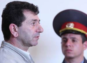 A group of citizens gather outside court in support of jailed colonel  