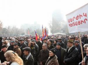 Rally participants hold poster calling for early elections