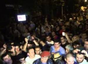 People sing national anthem on Baghramyan Avenue