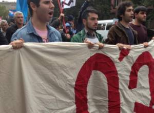 Police officers try to prevent march to Baghramyan Avenue