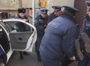 Vardges Gaspari is lying in police car