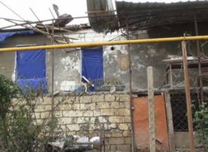 Head of regional administration gives interview without removing pistol from table