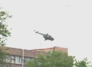 Helicopter seen hovering above seized police building
