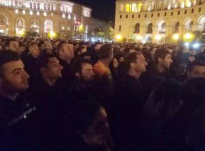 LIVE. Day 7:  Protesters listening to System of a Down under umbrellas 