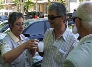 Protesters drink champagne to celebrate their victory