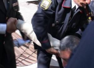 Protester dragged out of tent
