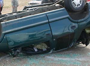 One dies as car overturns on roadway