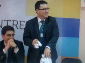 Ambassador Trajan Hristea mixes up slips of paper befor naming winner