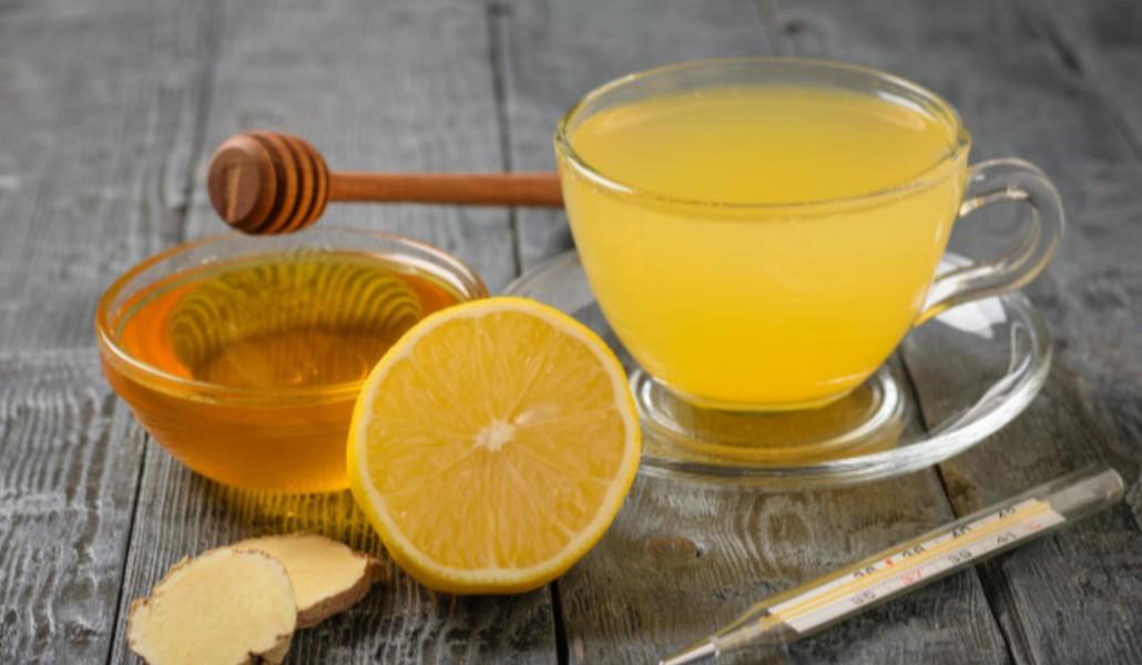 drink-ginger-root-lemon-orange-honey-cinnamon-thermometer-black-wooden-table_94064-282