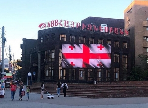 Billboards on streets of Yerevan illuminated in colors of Georgian flag