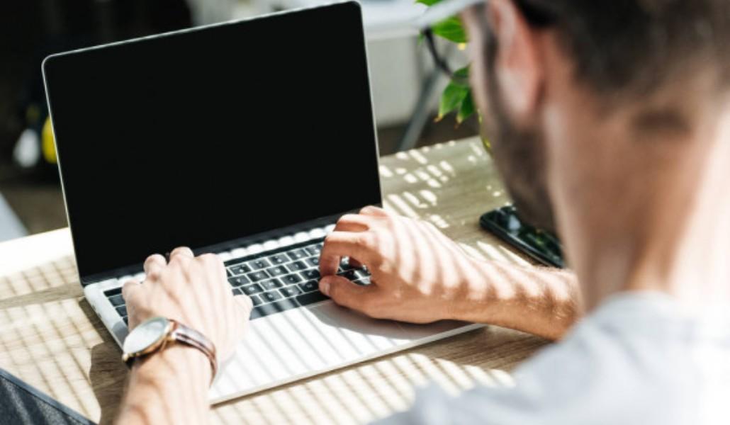 depositphotos_208503880-stock-photo-back-view-of-man-using